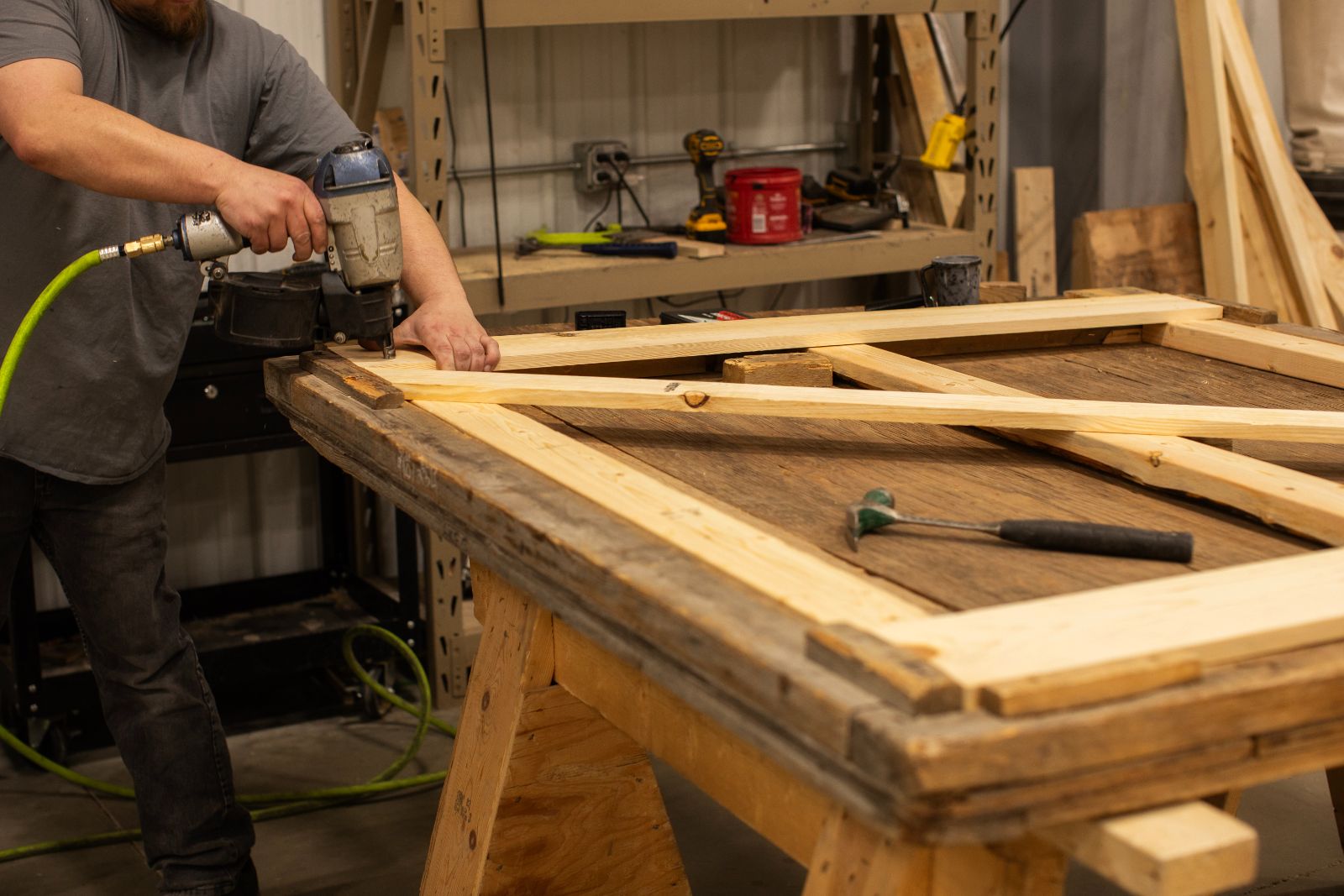 man doing construction on a custom wood crate