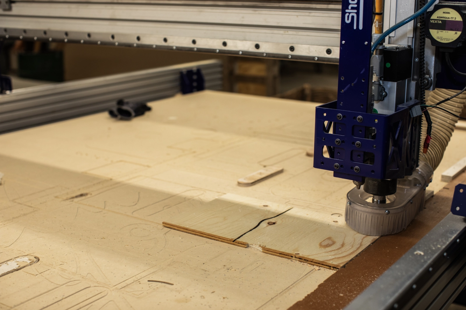 a tool cutting a wooden board