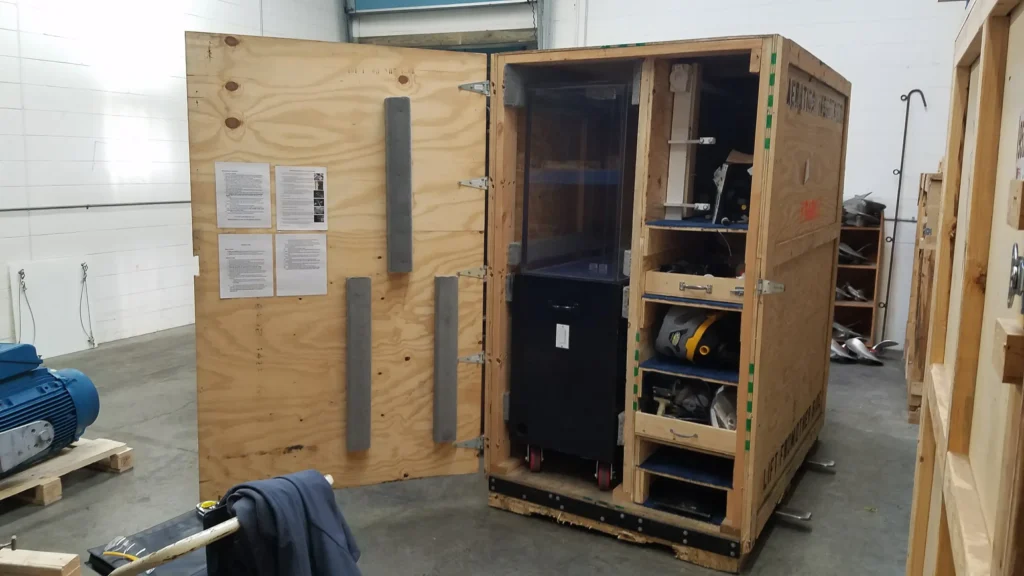 open container showing shelves and drawers custom created for tradeshow material stoaage